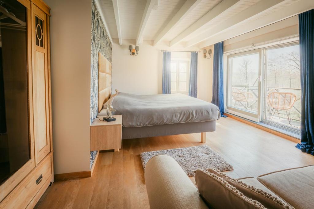 Postel nebo postele na pokoji v ubytování Kokerelle vakantiewoningen