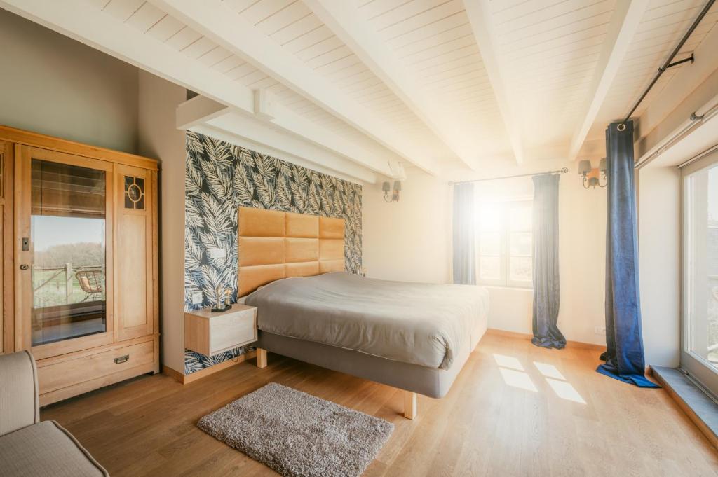 Postel nebo postele na pokoji v ubytování Kokerelle vakantiewoningen