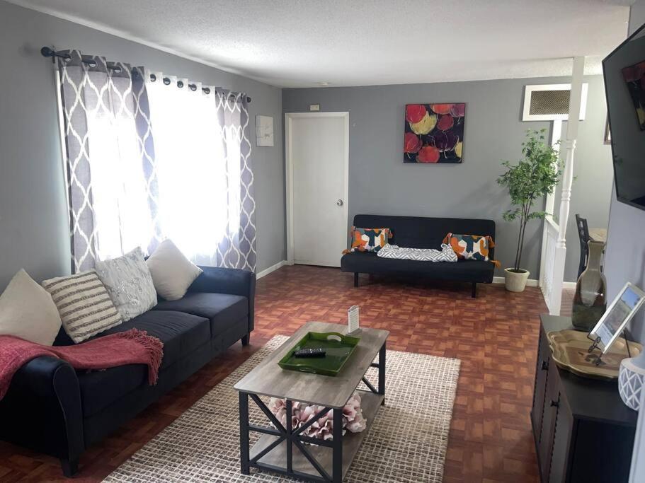 a living room with a couch and a table at Miracle House in Brooklyn Park