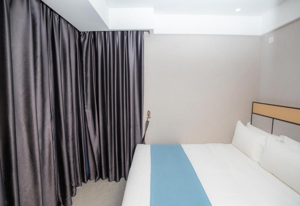 Postel nebo postele na pokoji v ubytování ARK HOTEL
