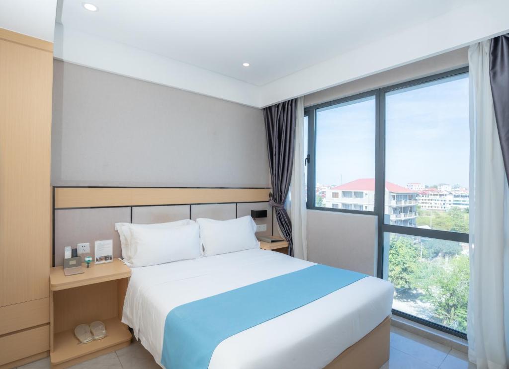 Postel nebo postele na pokoji v ubytování ARK HOTEL