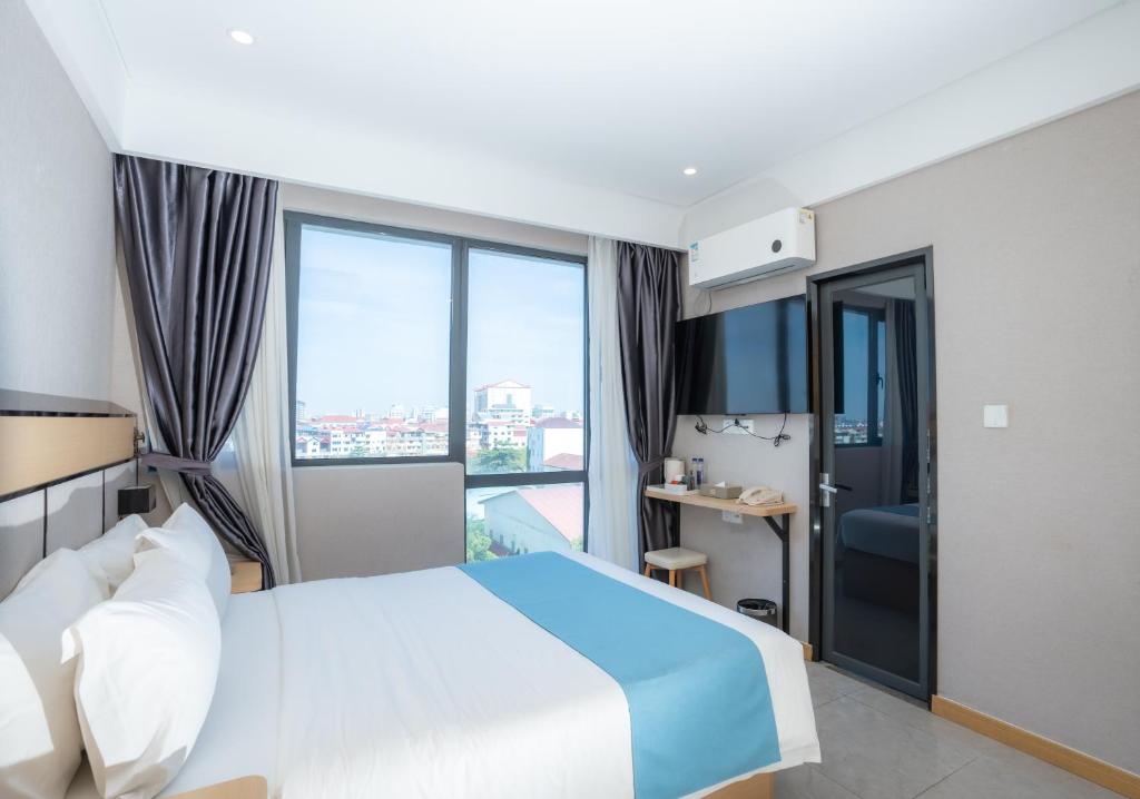 Postel nebo postele na pokoji v ubytování ARK HOTEL