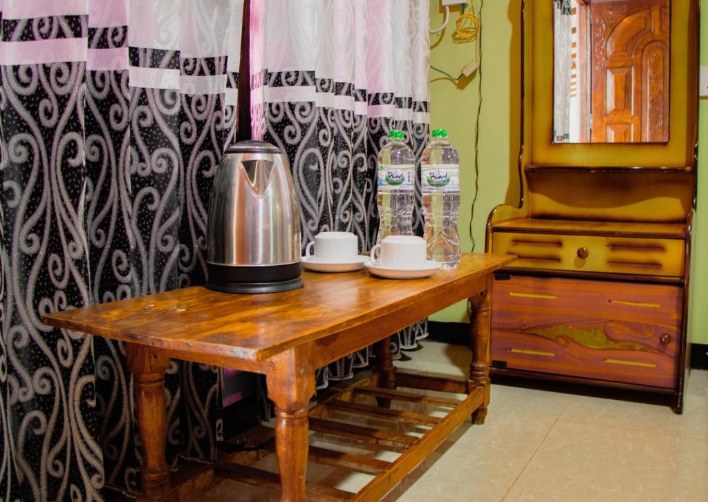 Příslušenství pro přípravu čaje a kávy v ubytování Nine Arch Homestay
