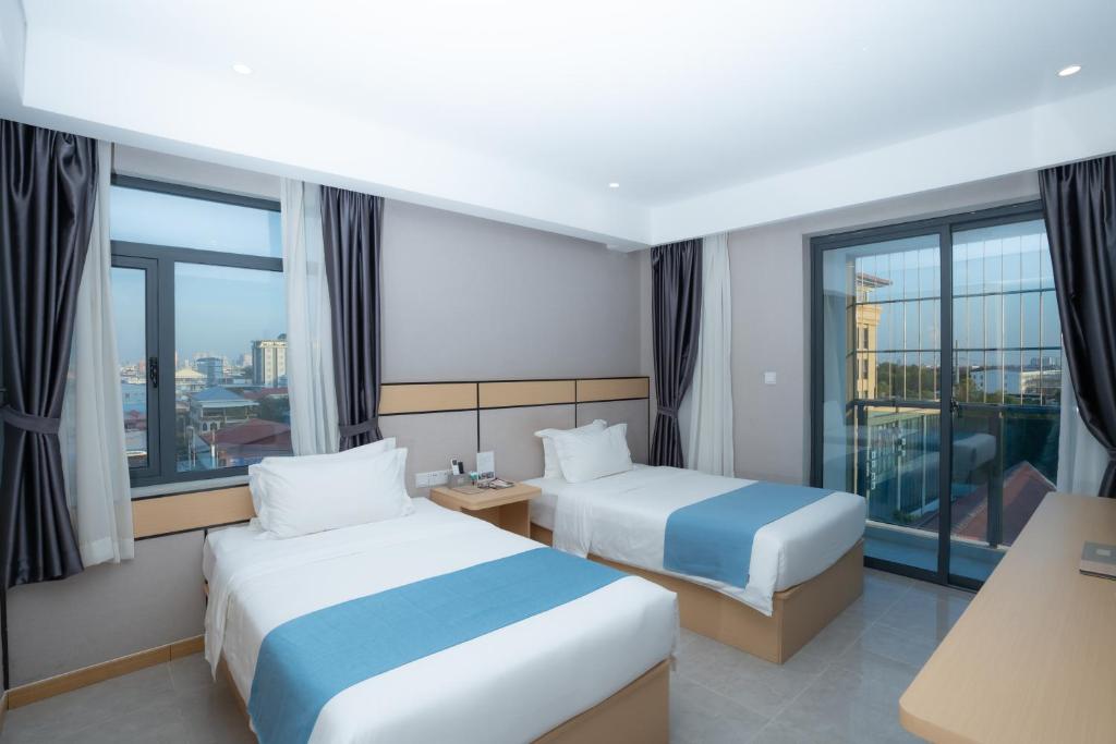 Postel nebo postele na pokoji v ubytování ARK HOTEL