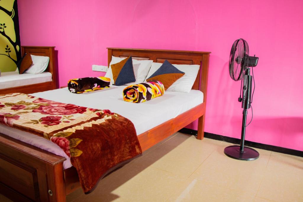 Postel nebo postele na pokoji v ubytování Nine Arch Homestay