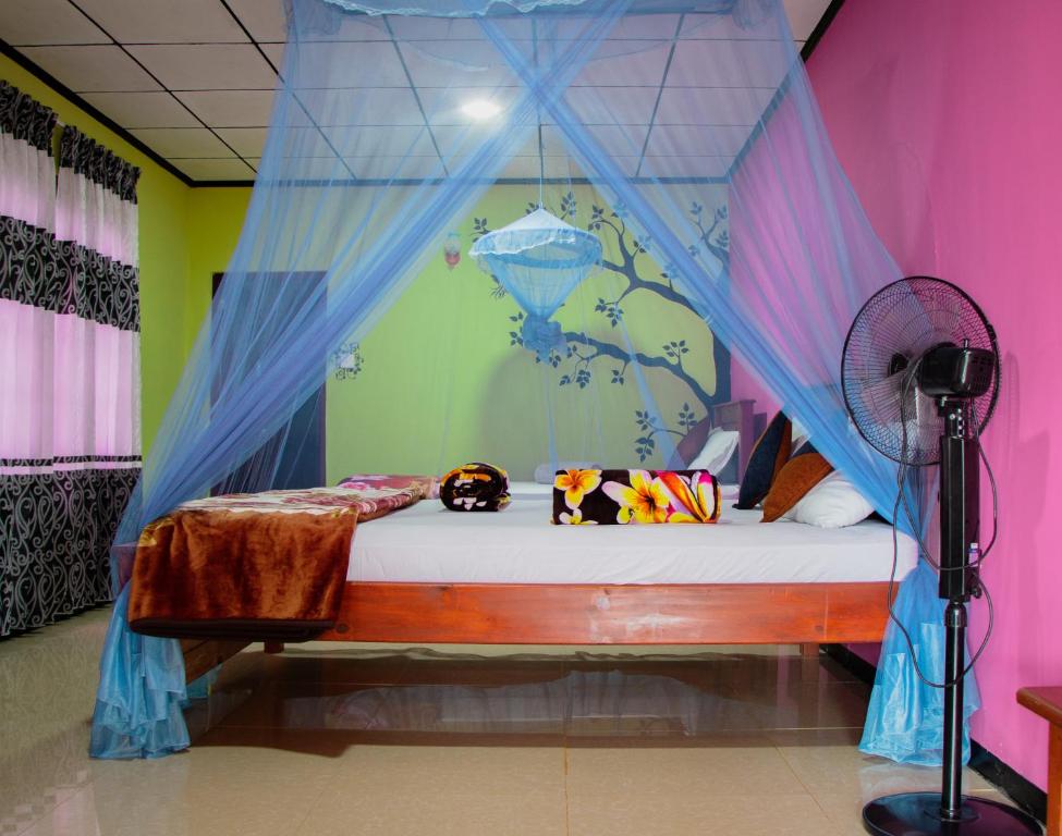 Postel nebo postele na pokoji v ubytování Nine Arch Homestay