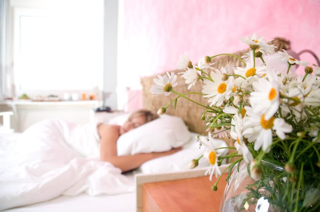A bed or beds in a room at The Marmara Antalya
