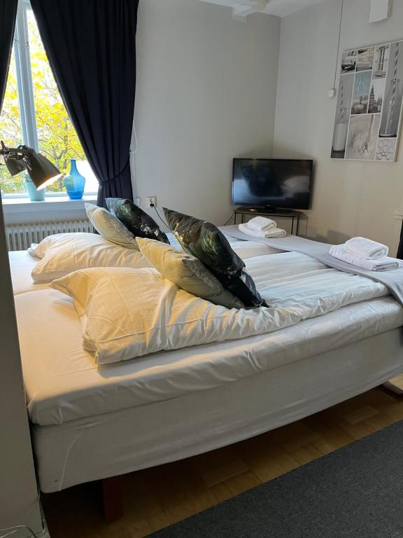 Postel nebo postele na pokoji v ubytování Västerhöjdsgården