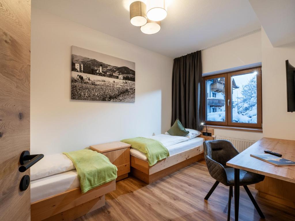 Postel nebo postele na pokoji v ubytování Brixentalerhof