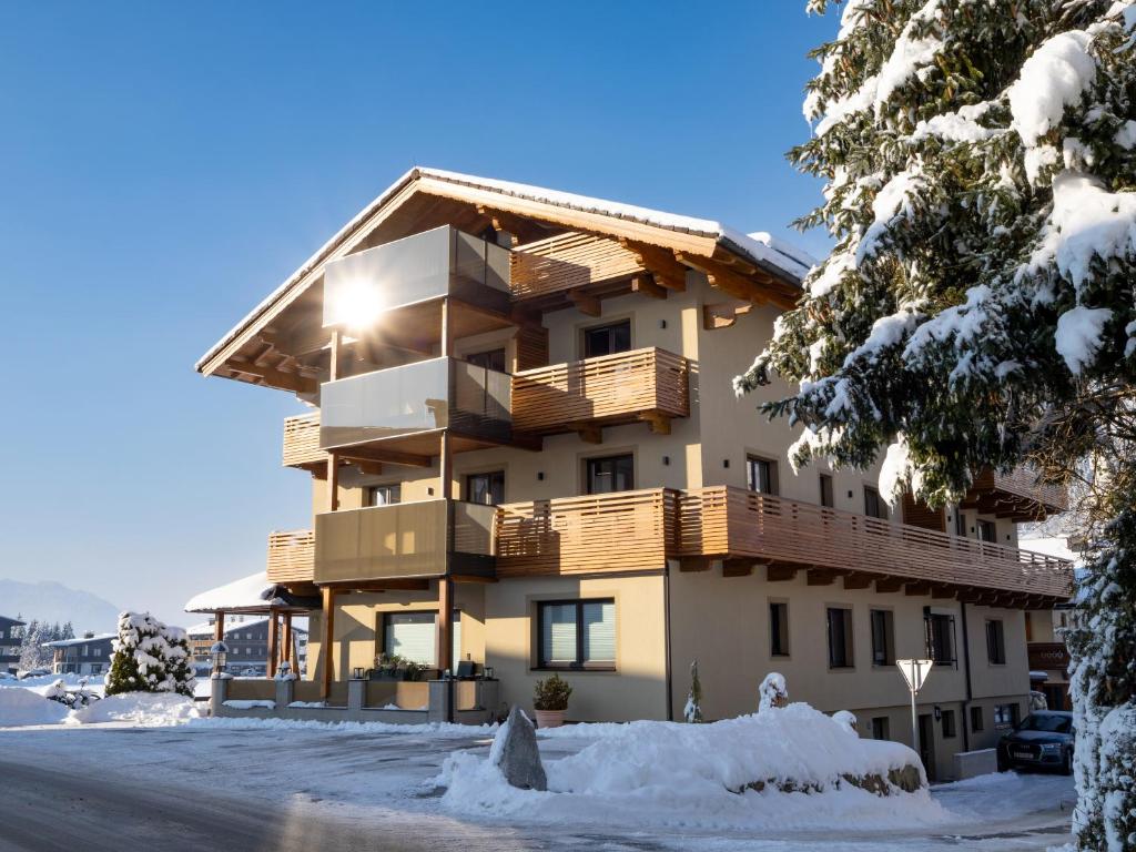 a building with snow in front of it at Brixentalerhof in Westendorf