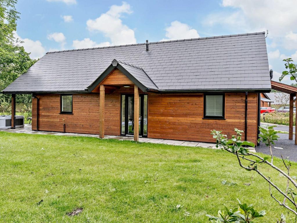 a wooden house with a large yard at 2 Bed in Gower 91726 
