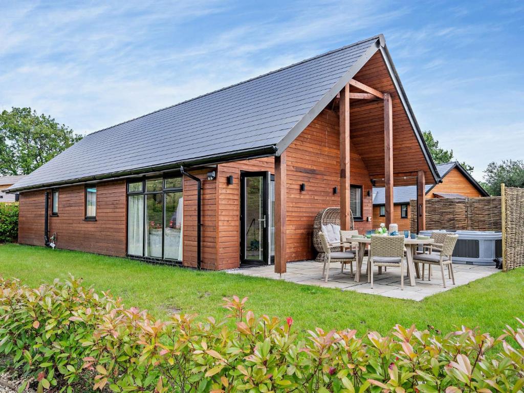 a house with a solar roof and a patio at 3 Bed in Gower 91721 