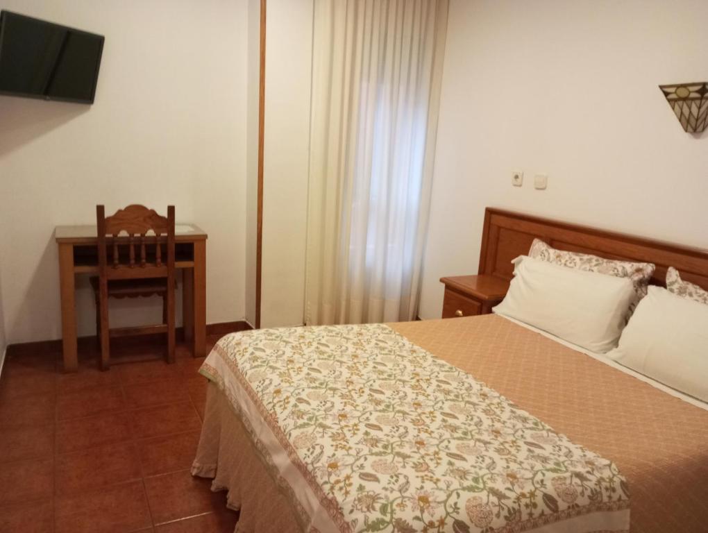 Postel nebo postele na pokoji v ubytování Hospedaje Magallanes