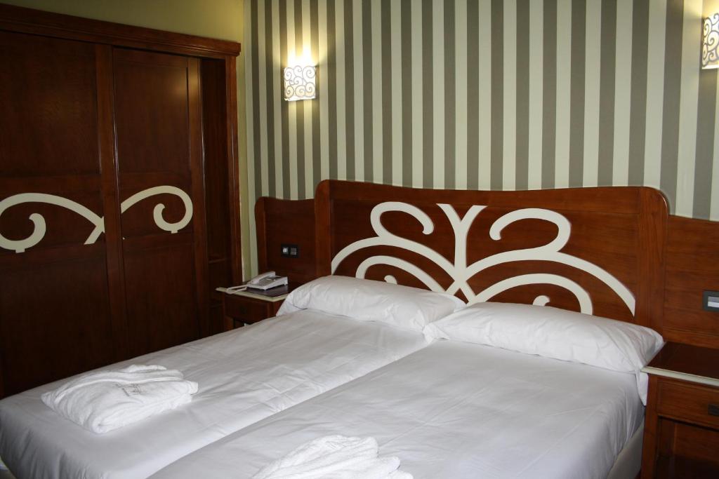 Postel nebo postele na pokoji v ubytování Hotel Rural El Reundu