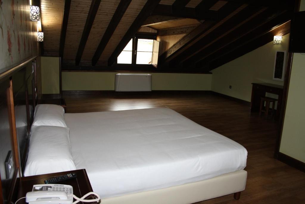 Postel nebo postele na pokoji v ubytování Hotel Rural El Reundu