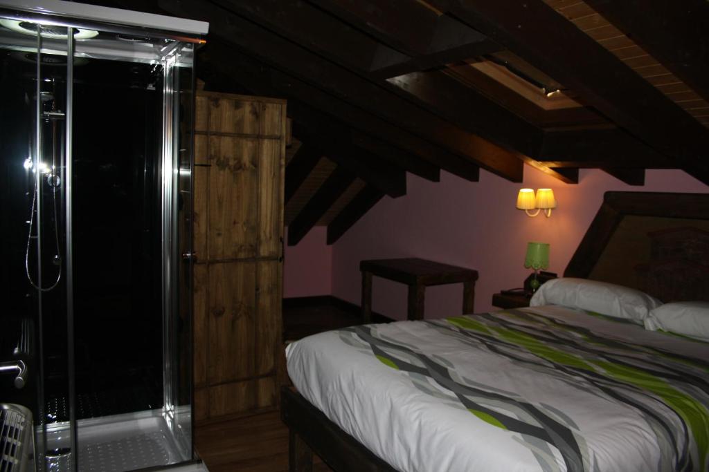 Postel nebo postele na pokoji v ubytování Hotel Rural El Reundu