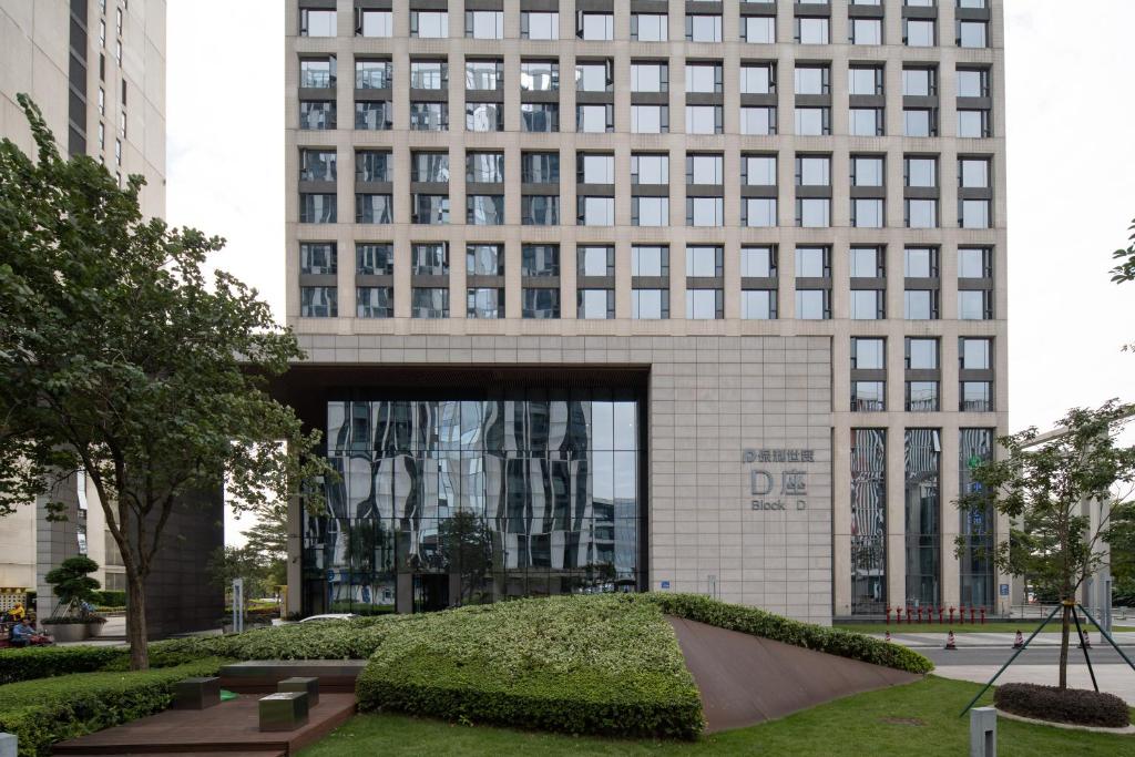 a building with a skate park in front of it at Snug Gaokong Jiangjing Hotel in Guangzhou