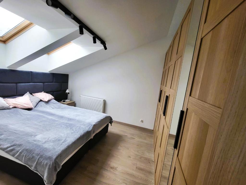 Postel nebo postele na pokoji v ubytování Apartament Spokojna Wisła