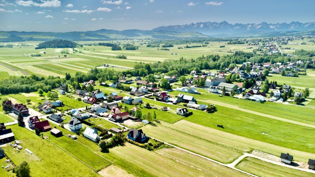an aerial view of a small village in a field at Apartament Janusza in Gronków