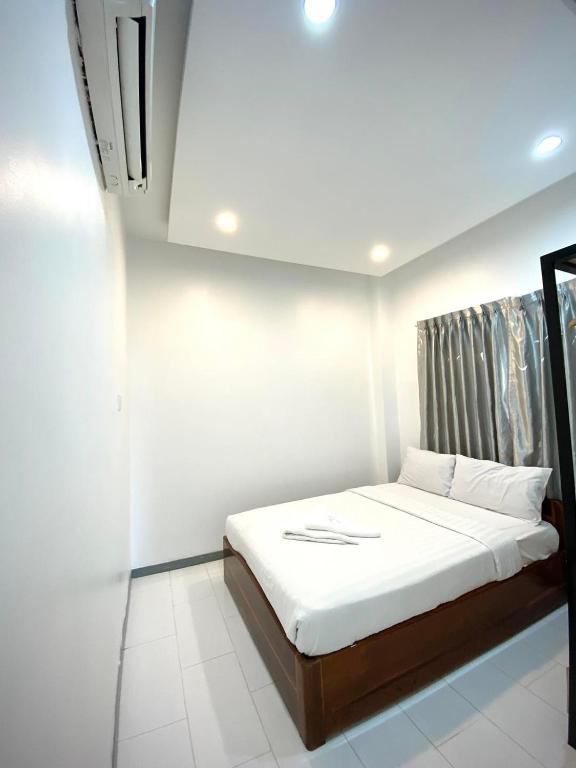 Postel nebo postele na pokoji v ubytování White Residence Hotel & Apartment