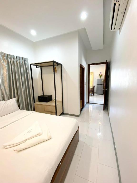 Postel nebo postele na pokoji v ubytování White Residence Hotel & Apartment