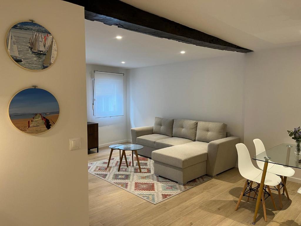 a living room with a couch and a table at Apartamento centro Santander in Santander