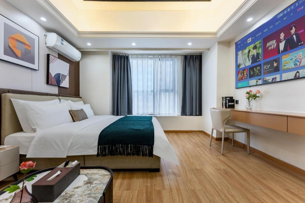 Postel nebo postele na pokoji v ubytování East Maple International Apartment - Guangzhou Luogang Wanda Plaza Suyuan Metro Station