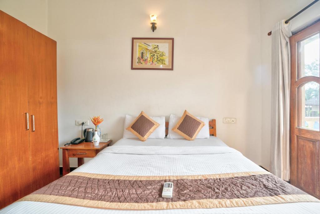 Postel nebo postele na pokoji v ubytování Casa De Royale - Anjuna