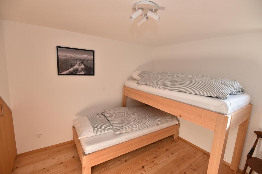 Postel nebo postele na pokoji v ubytování Fantastic renovated Chalet in the heart of Alps