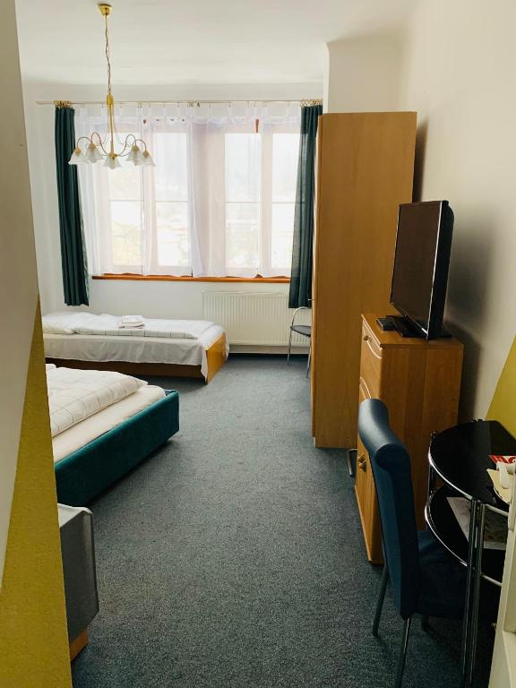 Postel nebo postele na pokoji v ubytování Hotel Slovan