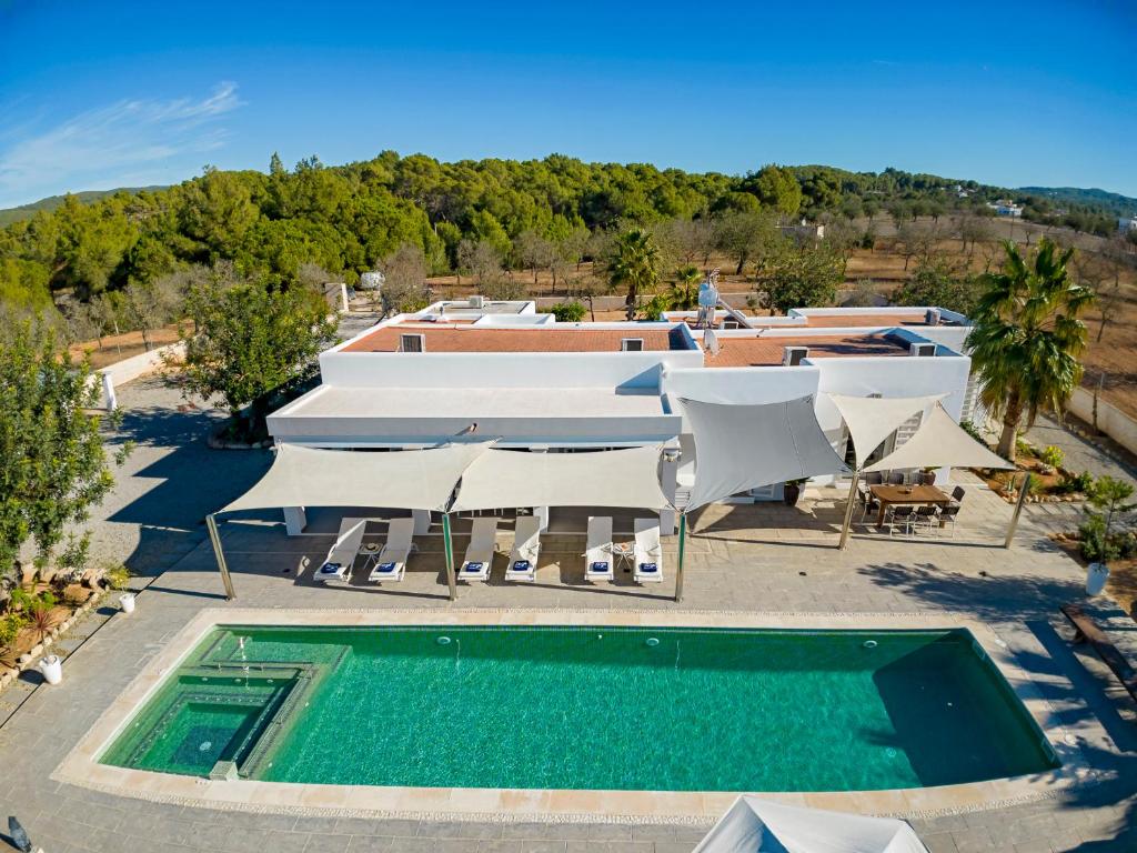 an image of a swimming pool at a resort at Villa near San Antonio sleeps 10 in Ses Paisses