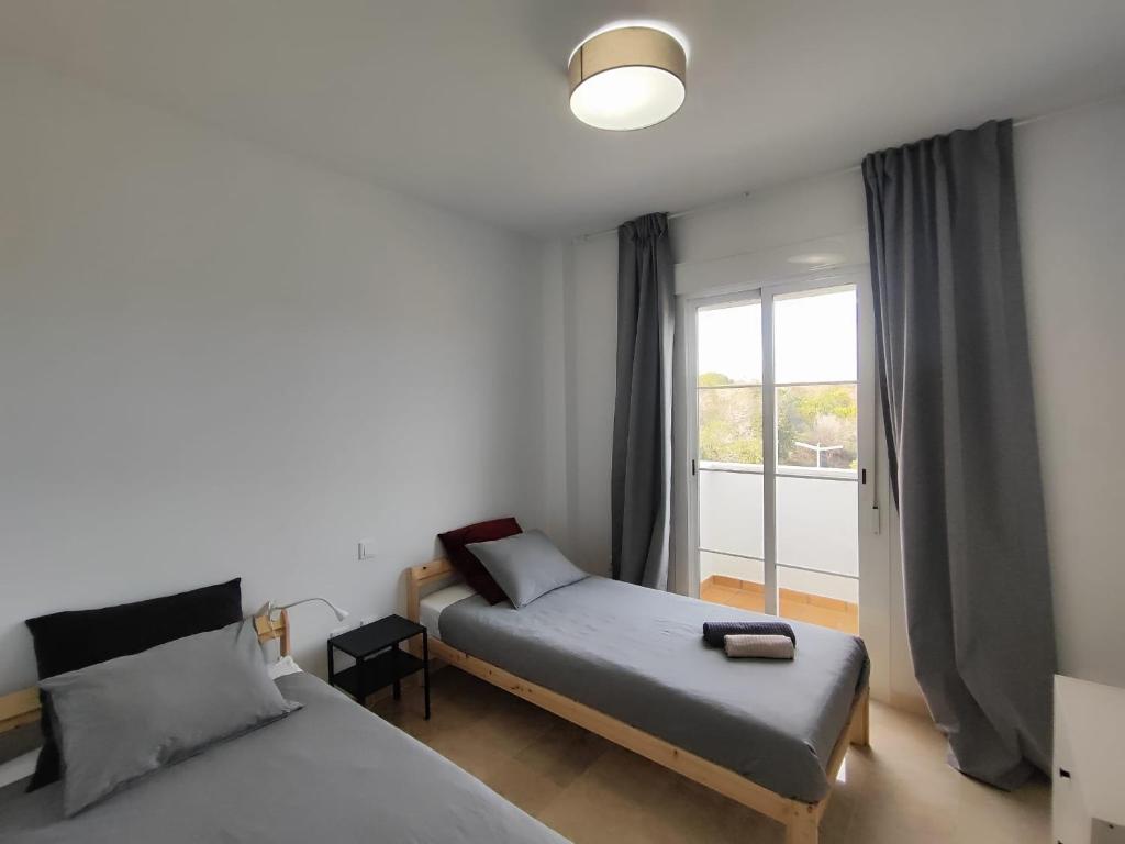 Postel nebo postele na pokoji v ubytování Apartamento Happy Days