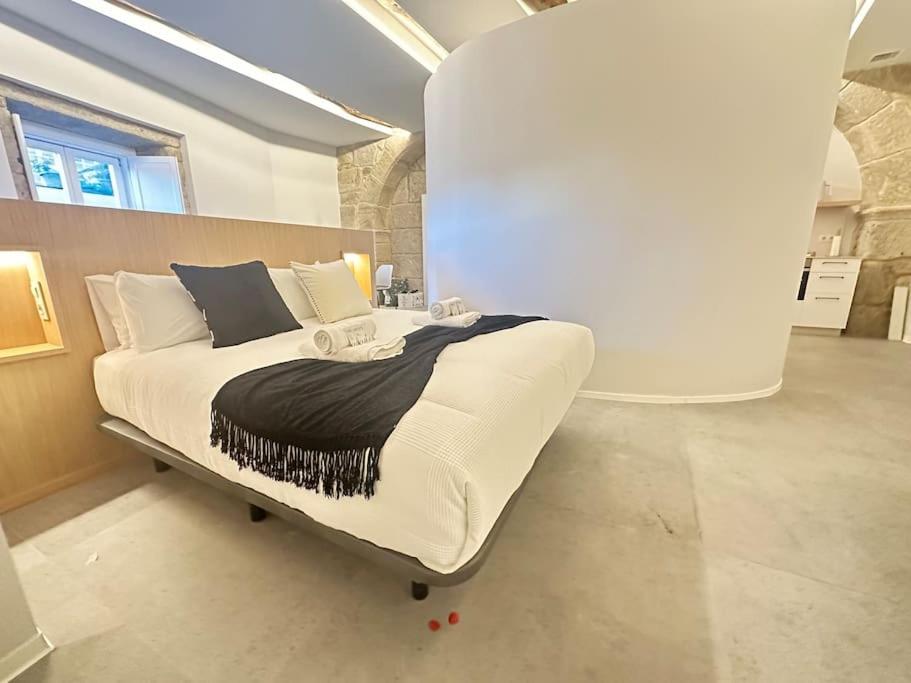 Llit o llits en una habitació de Luxury Downtown C. Del Tratado B