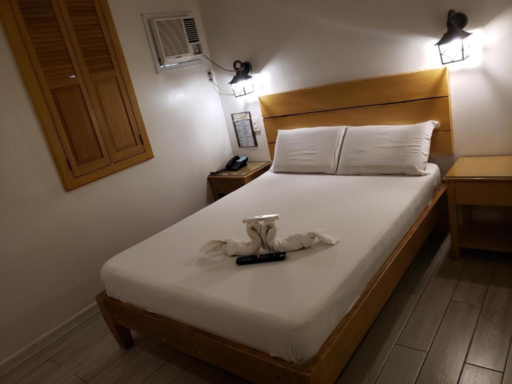Postel nebo postele na pokoji v ubytování Le Verde Lodge