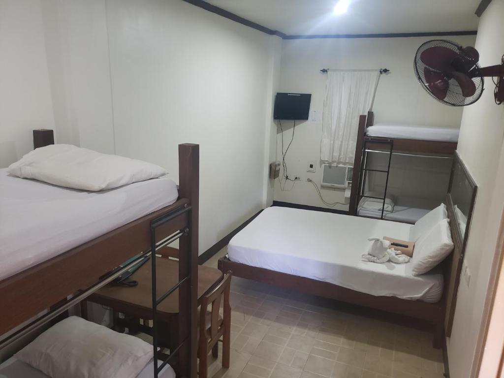 Postel nebo postele na pokoji v ubytování Le Verde Lodge