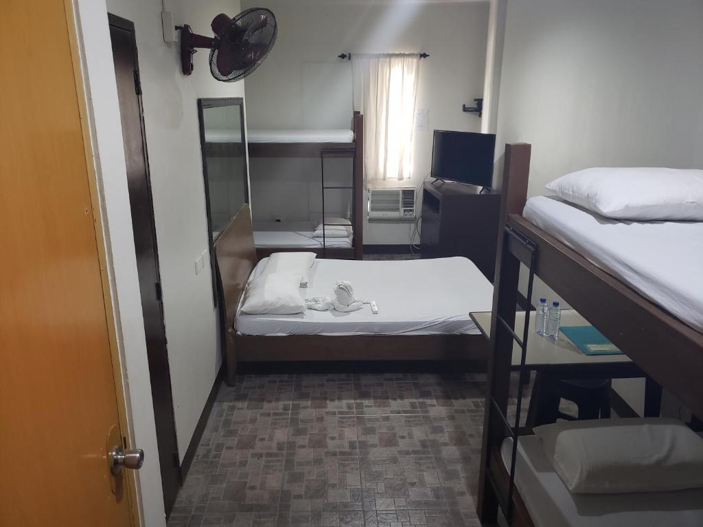 Postel nebo postele na pokoji v ubytování Le Verde Lodge
