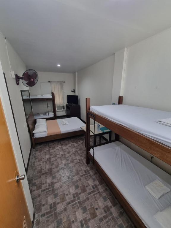 Postel nebo postele na pokoji v ubytování Le Verde Lodge