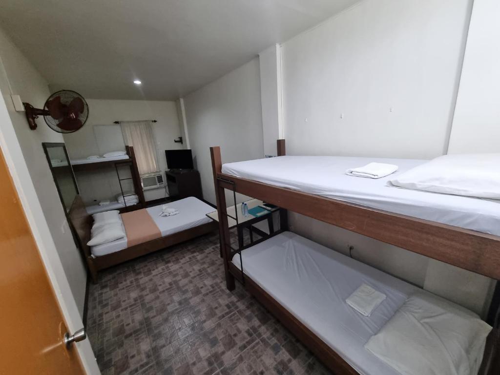 Postel nebo postele na pokoji v ubytování Le Verde Lodge