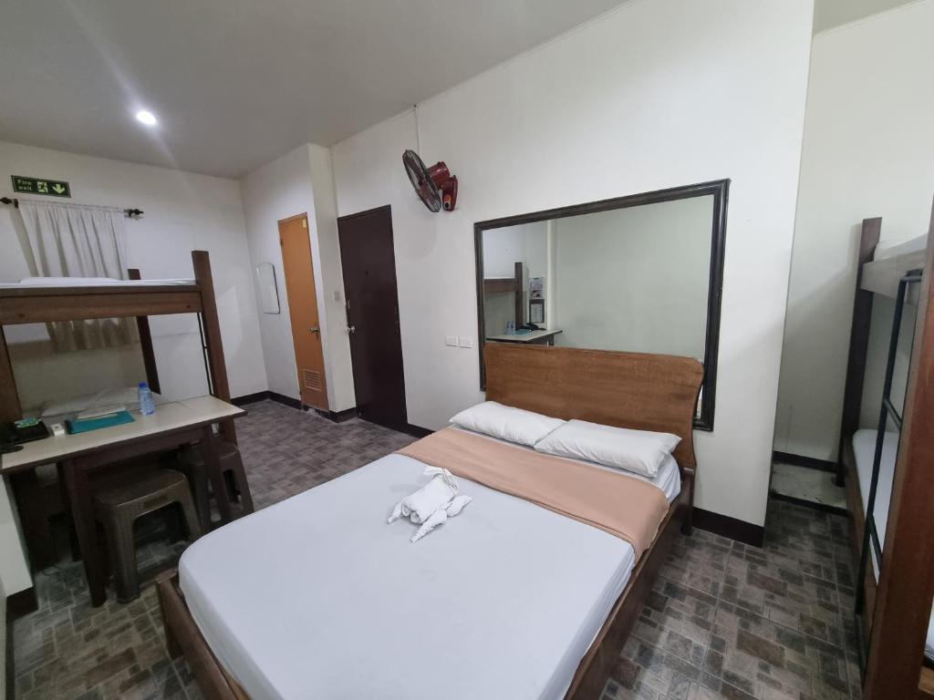 Postel nebo postele na pokoji v ubytování Le Verde Lodge