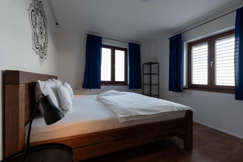 Postel nebo postele na pokoji v ubytování PALAVIA Apartments