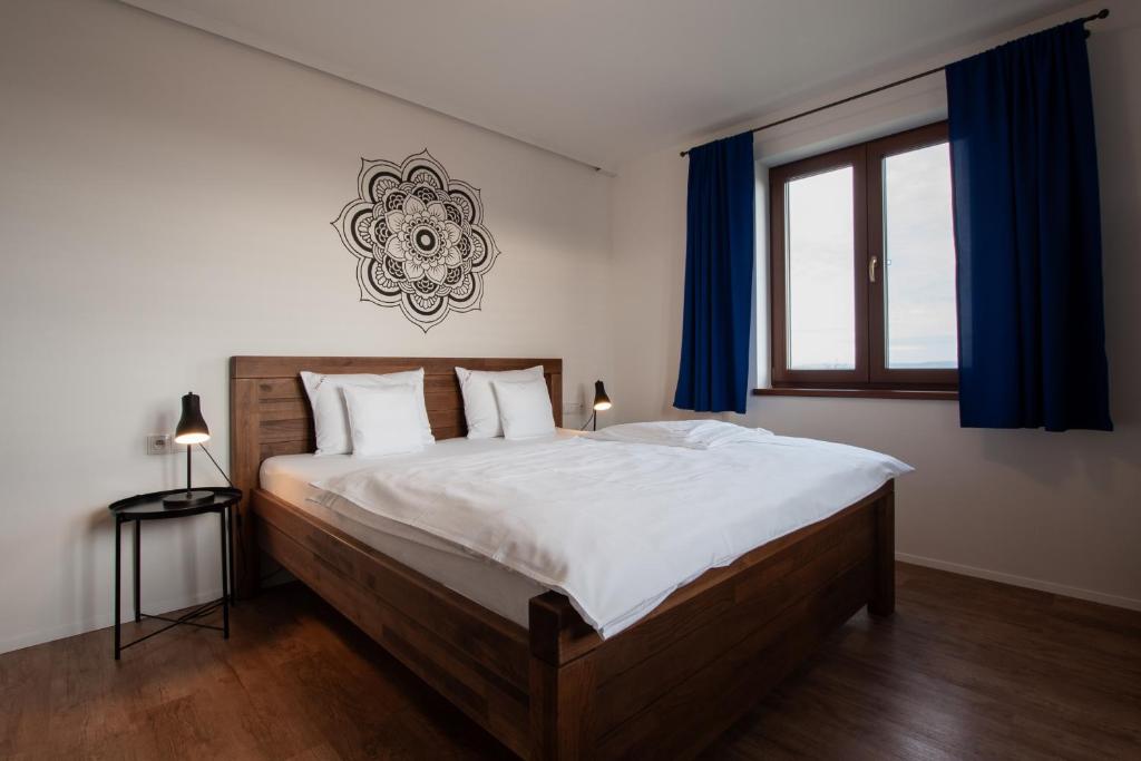 Postel nebo postele na pokoji v ubytování PALAVIA Apartments