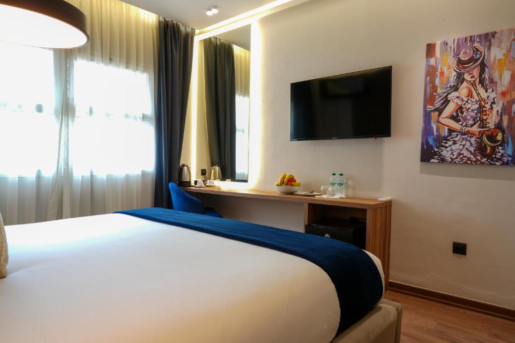 Postel nebo postele na pokoji v ubytování Le M Hôtel