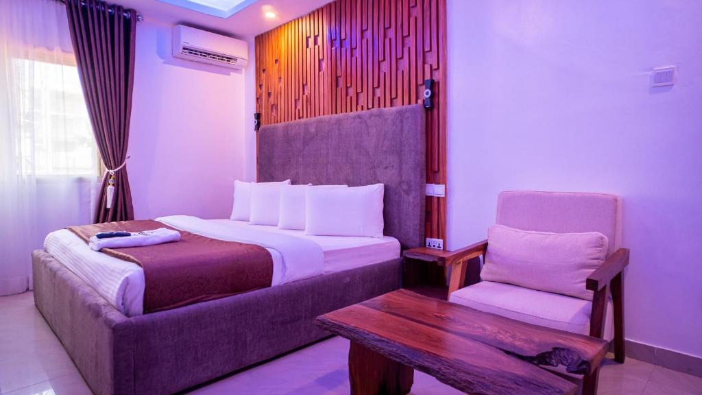 Ένα ή περισσότερα κρεβάτια σε δωμάτιο στο Presken Hotels Ikoyi