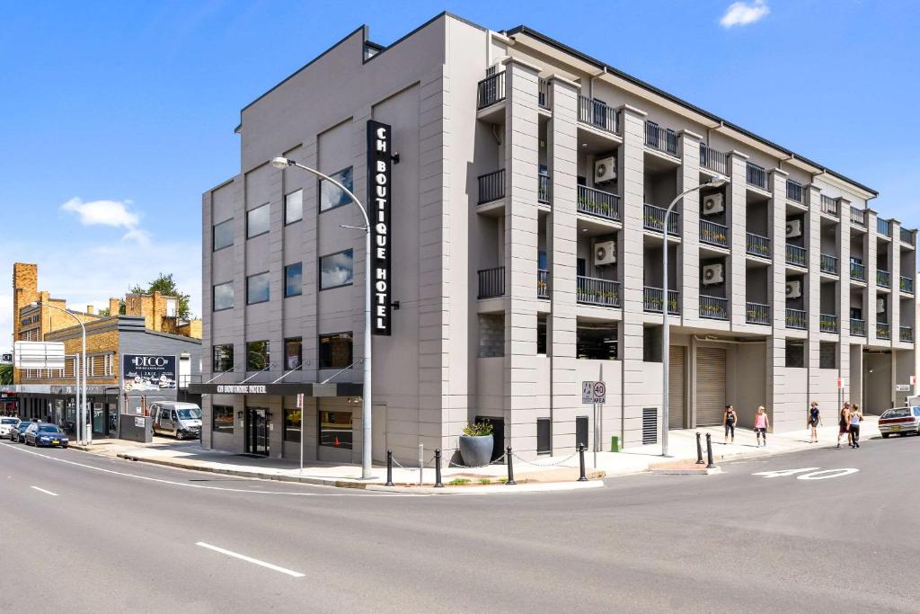 a rendering of a building on the corner of a street at CH Boutique Hotel, Ascend Hotel Collection in Tamworth