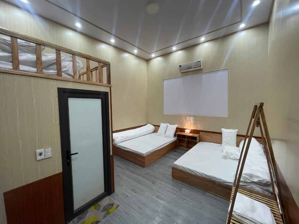 Postel nebo postele na pokoji v ubytování Flourish Homestay