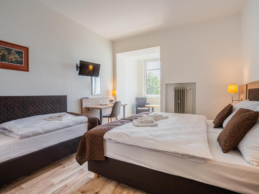 Postel nebo postele na pokoji v ubytování EA Hotel Lipno