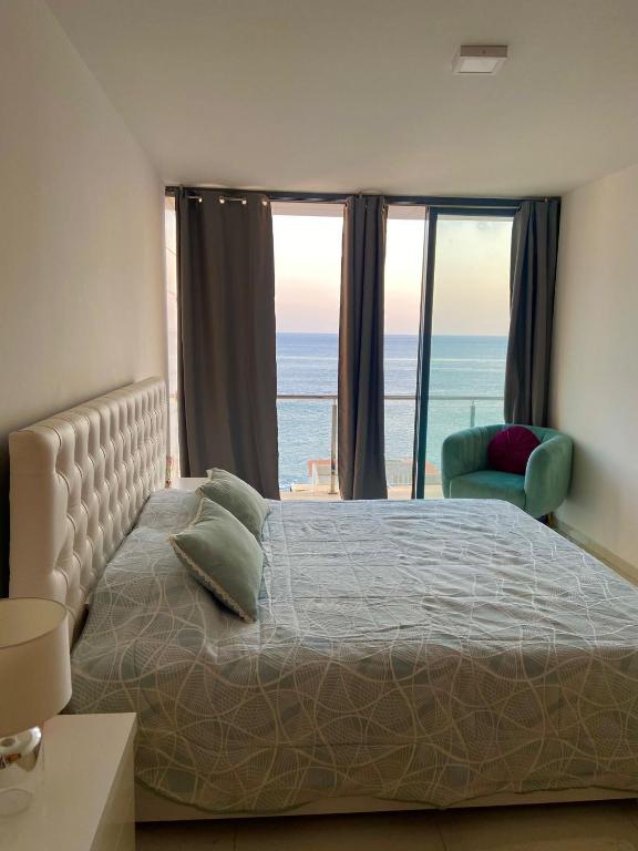 Postel nebo postele na pokoji v ubytování NICE DUPLEX, PRAIA