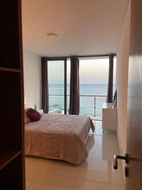 Postel nebo postele na pokoji v ubytování NICE DUPLEX, PRAIA