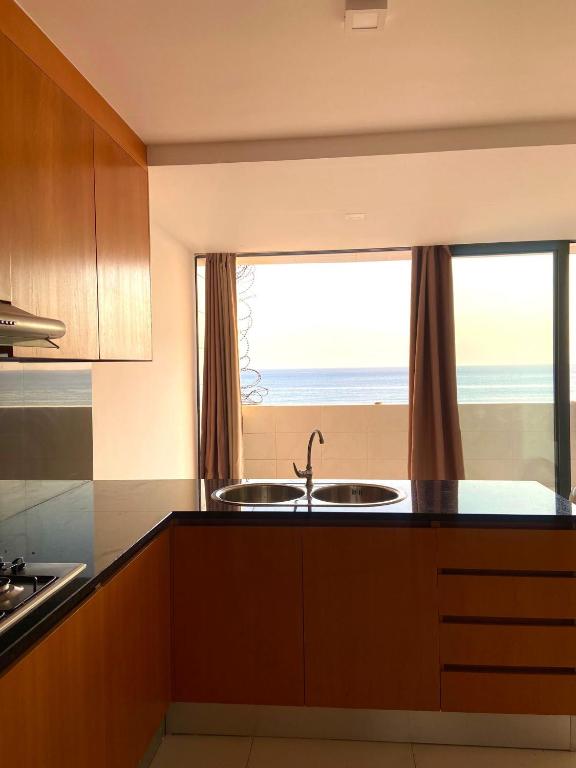 Kuchyň nebo kuchyňský kout v ubytování NICE DUPLEX, PRAIA