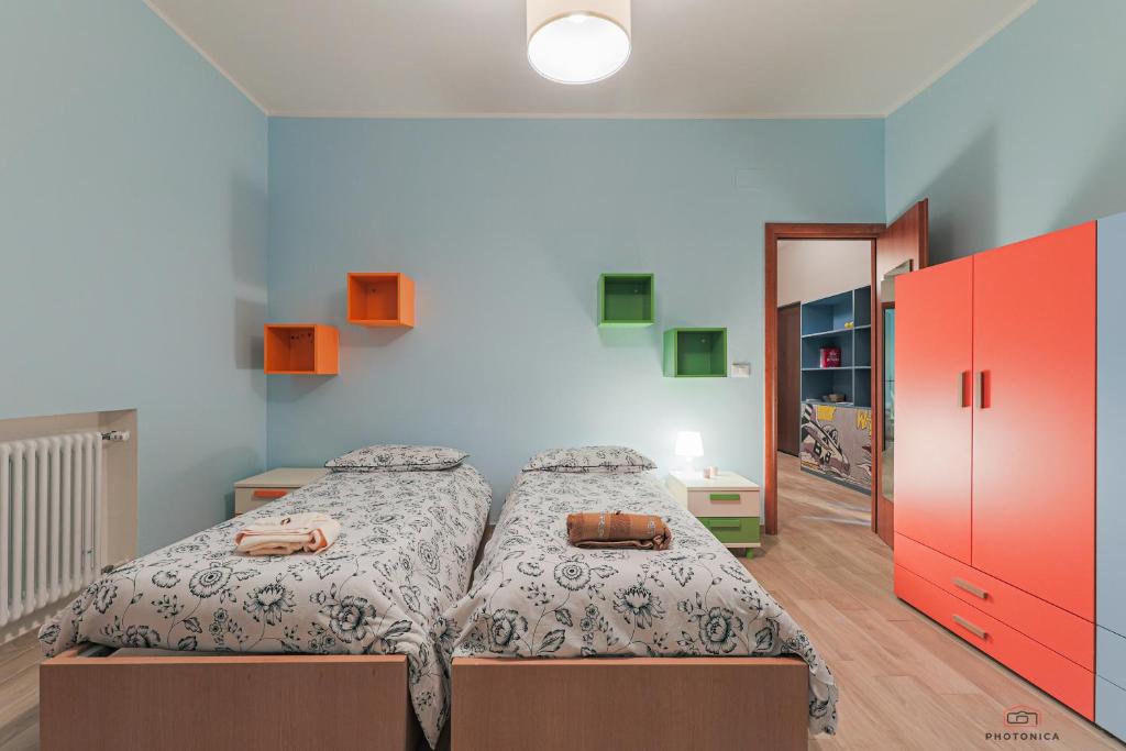 Łóżko lub łóżka w pokoju w obiekcie Casa di Ily